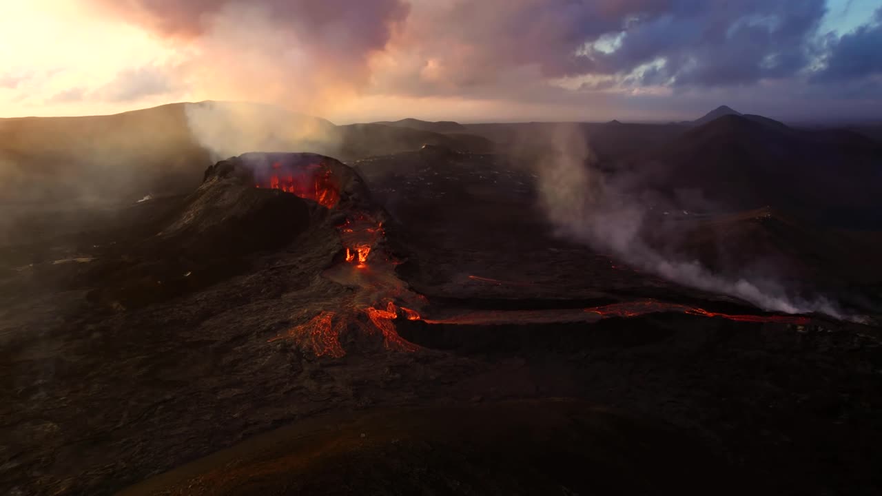 A 4K drone, aerial cinematic capture of a Volcano mouth opening and lava flowing down with the spectacular cloudy sky in the background