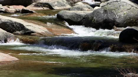 A-Mountain-Stream-Flows-Over-Boulders-(Loop)