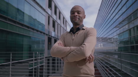 successful african american manager posing with crossed arms