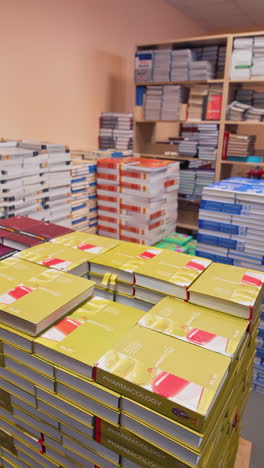 shot inside the university library. view of books organized in shelves in big medical university. vertical video