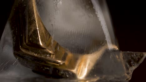 gold ring frozen in ice