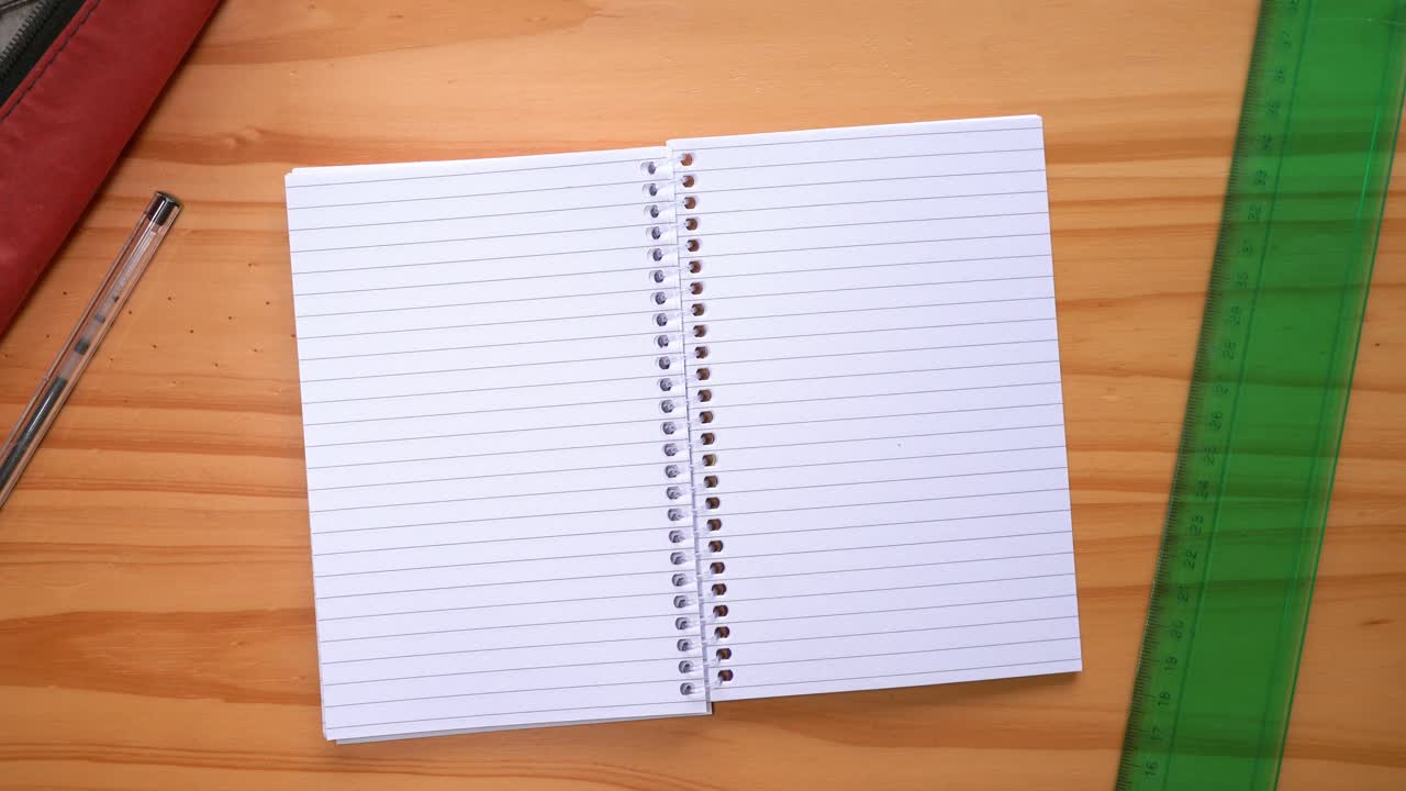 Male Hands Turning Blank Pages Of A Notebook On The Table