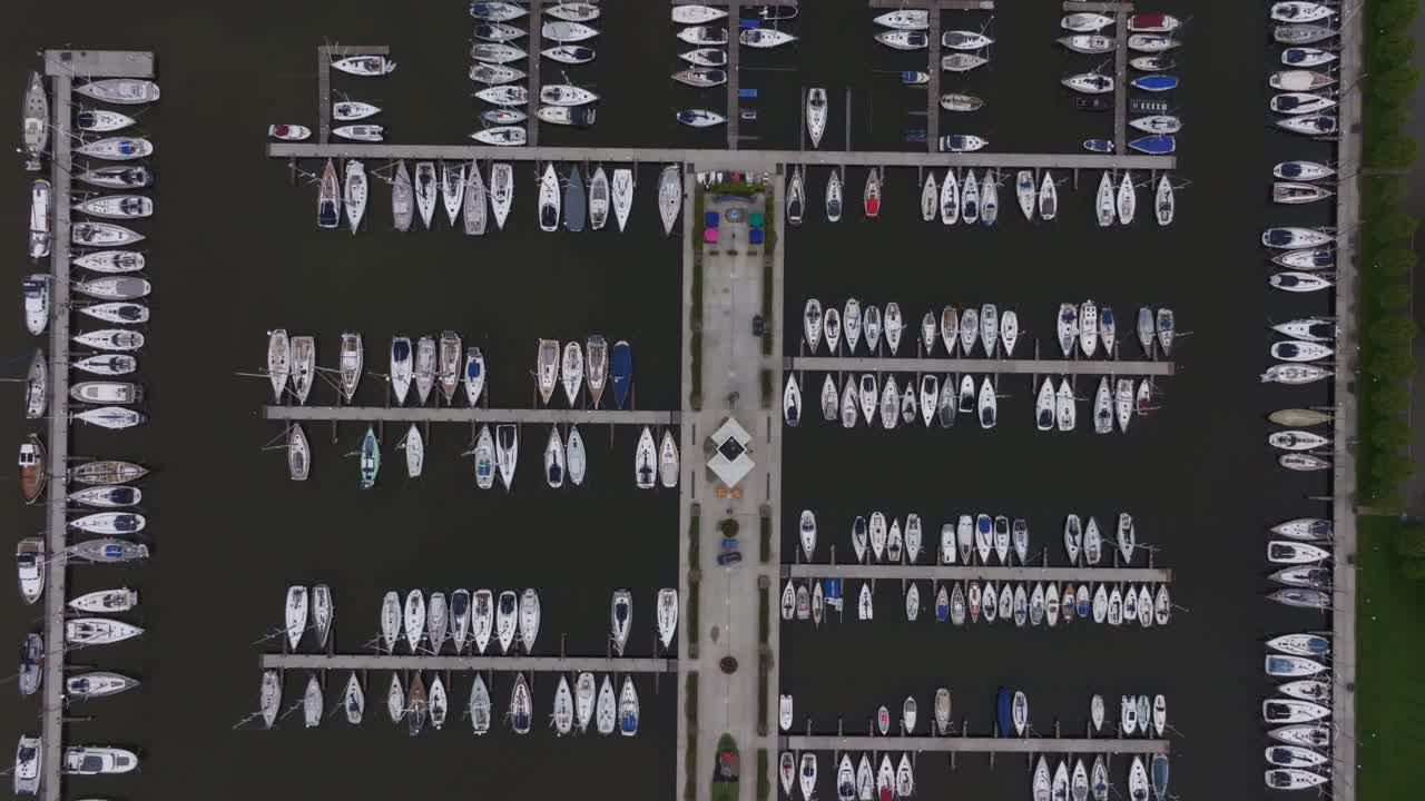 Fleet of sailing yachts at marina in Makkum, Friesland, Netherlands