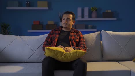 depressed man alone at home.