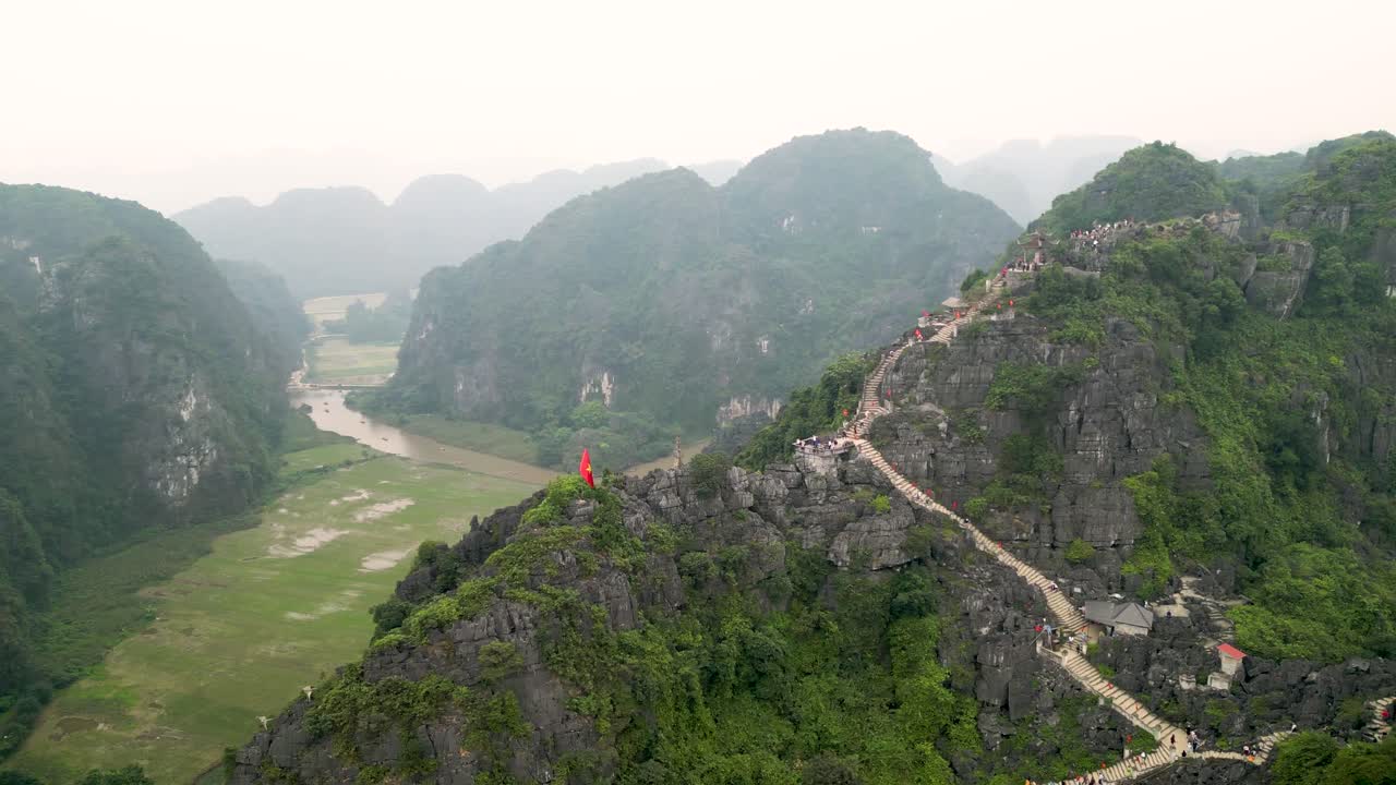 Aerial View of Hikers Climbing a Mountain Stairway in Vietnam
