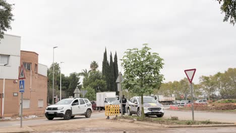 police directing traffic and helicopter assisting after a natural disaster in valencia