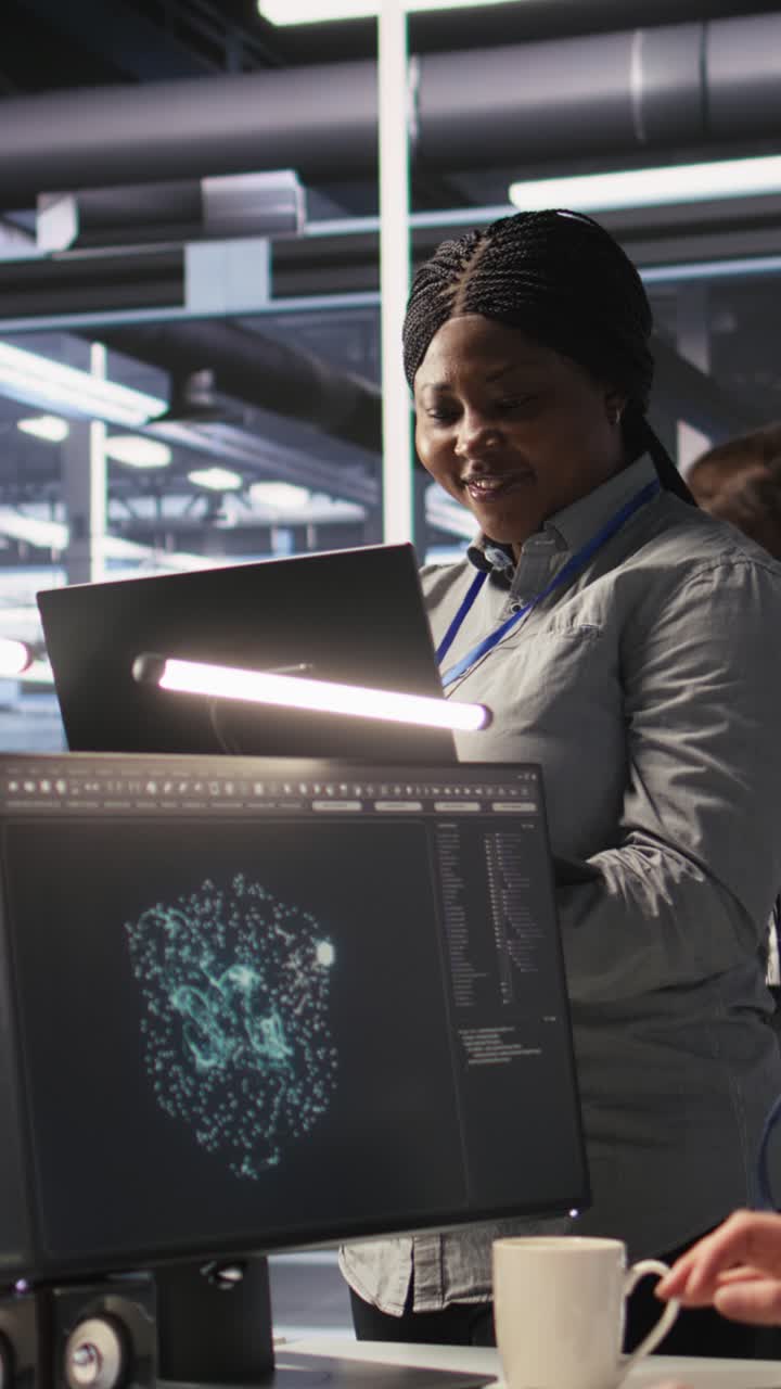 Vertical video Data center manager supervising engineer tasked with analyzing neural networks