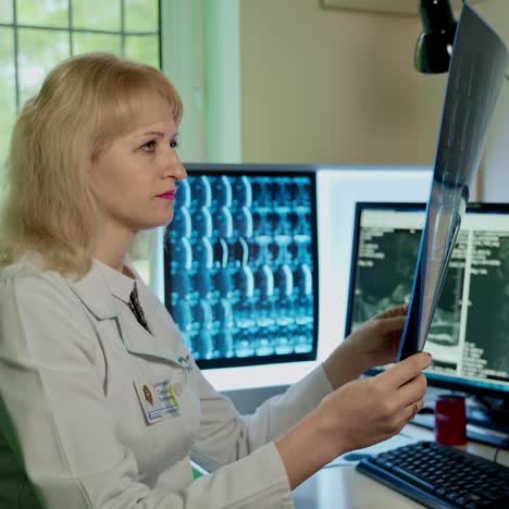 doctor examines x ray