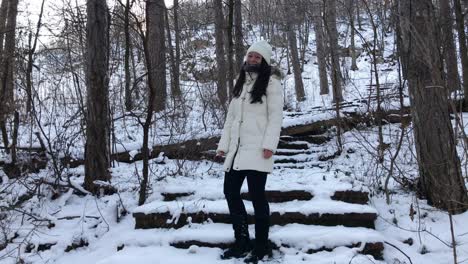 Woman-laughing-in-a-snowy-mountain.-Wide-shot