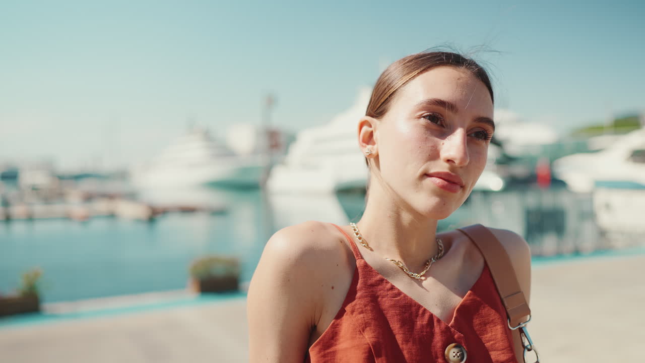 Woman in red dress at the marina