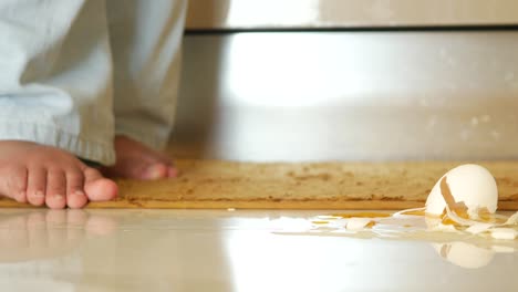 broken egg on kitchen floor