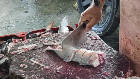 fish being prepared at a fish market