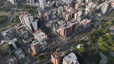 Aerial-drone-video-view-footage-of-Qutio-early-morning-sunrise-capital-city-of-Ecuador-La-Carolina-Park-traffic-Catedral-Metropolitana-de-Quito-south-american-skyline