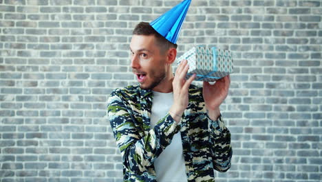 man excitedly receiving a gift