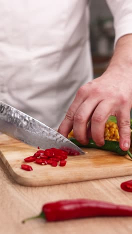 chopping chili peppers and vegetables