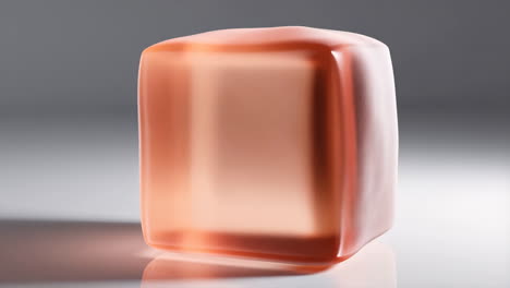 translucent orange rectangular object on reflective surface