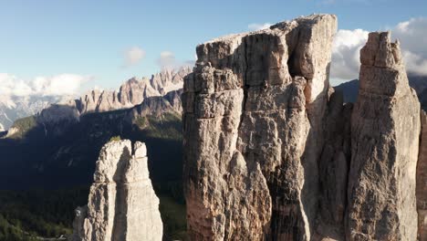 Aerial-Cinque-Torri-mountain-spires-with-Croda-da-Lago-in-background