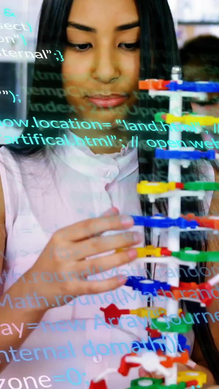 Teen student picking red clip and assembling tower, code overlay scrolling over hands learning code