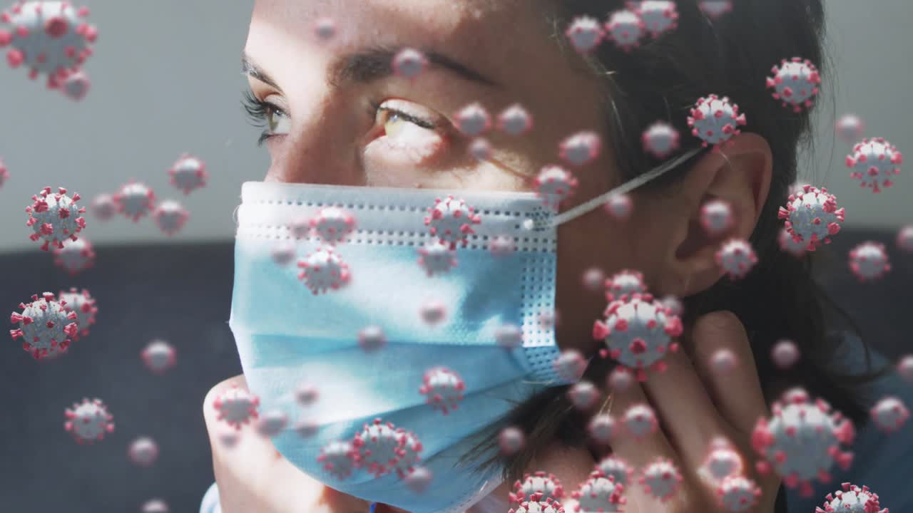 Woman touching chin adjusting mask securing loops for health with virus particles floating in front