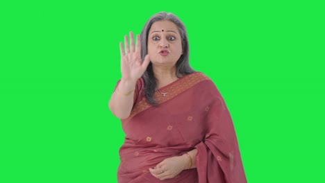 Angry-Indian-old-woman-stopping-someone-Green-screen