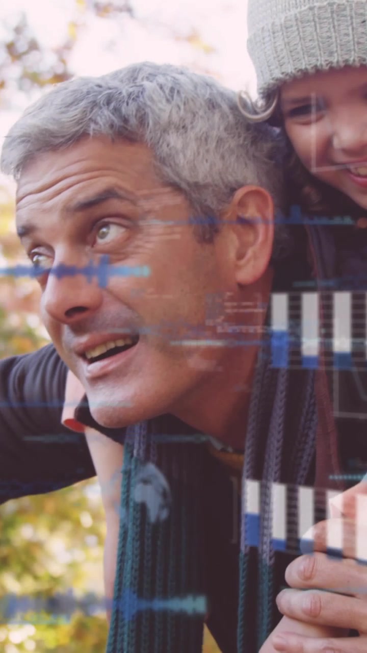 Vertical video: Man calling and carrying child on back, scanning as tech HUD bars drifting on faces