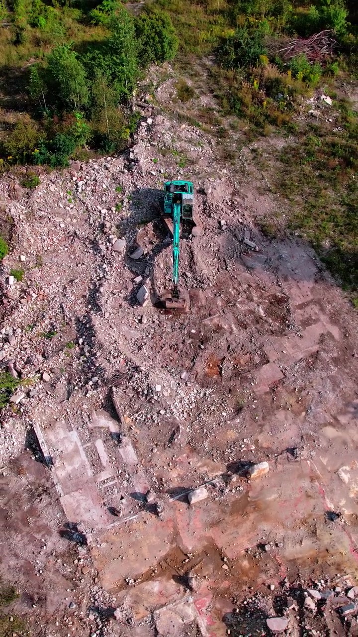 Construction site in Latvia shows machinery working on land clearing