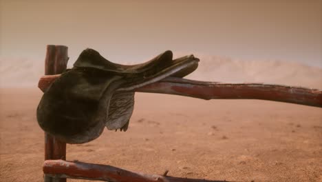 horse saddle on the fence in monument valley