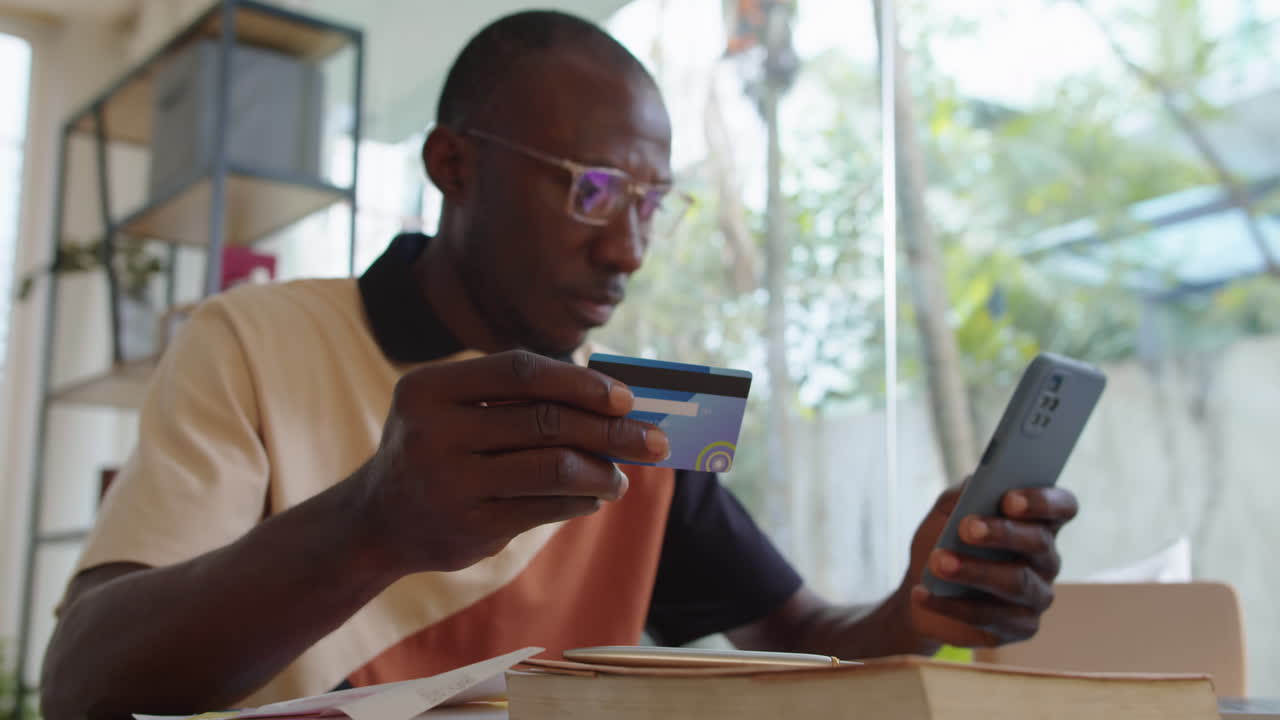 Man Filling out Payment Data Buying Online on Smartphone
