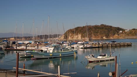 Beautiful-morning-at-fishing-harbor-with-multiple-vessels-parked