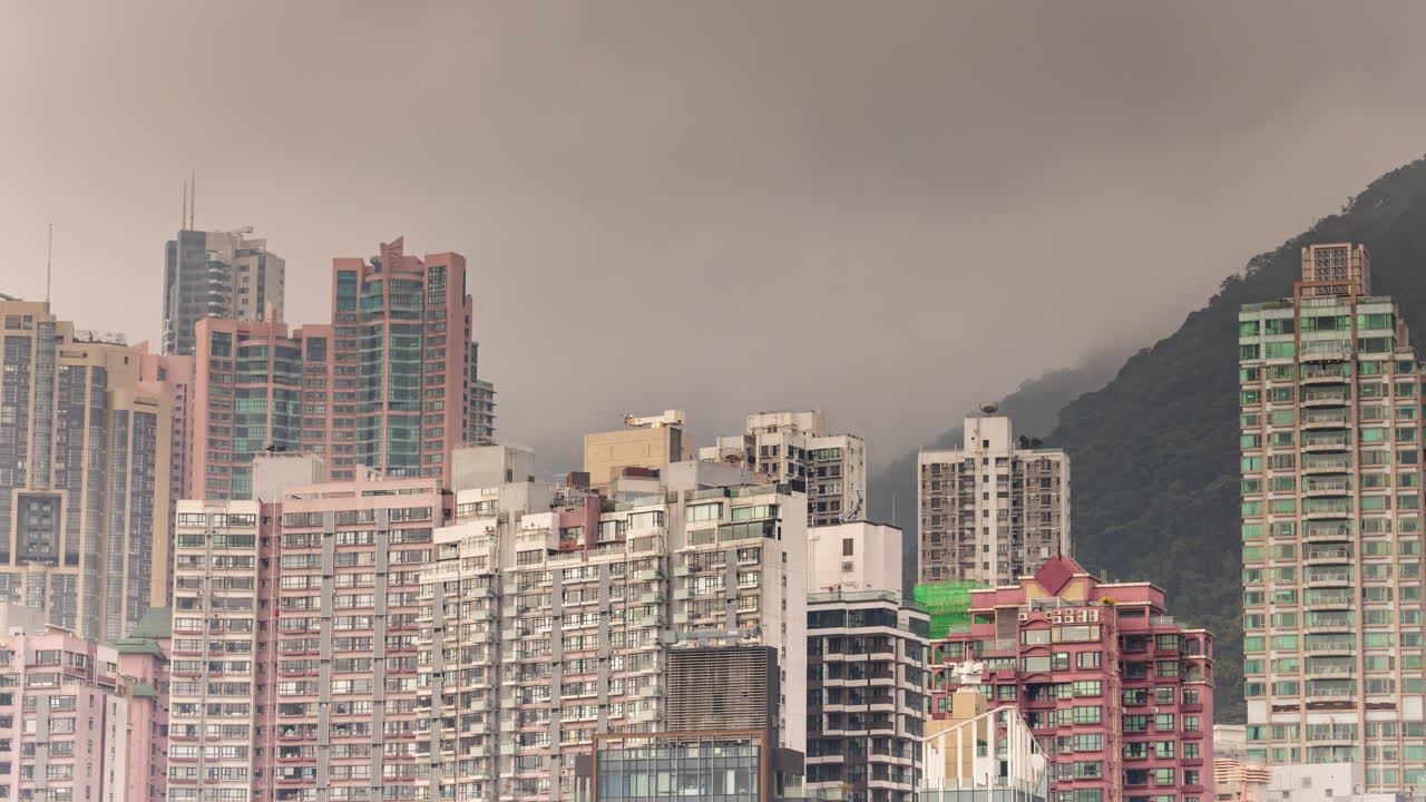 HONG KONG - 19 MARCH 2025 : Timelapse of the Hong Kong cental skyline from a high vantage point