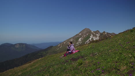 woman relaxing on a mountain hillside