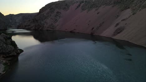 Drone-flight-over-the-river-at-the-edge-of-the-Zrmanja-gorge-in-Jasenice,-Zadar-County,-Croatia