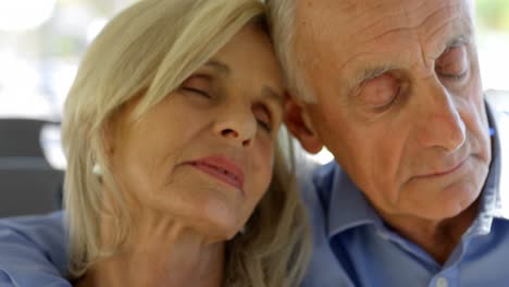 Senior-couple-relaxing-while-travelling-in-bus-4k