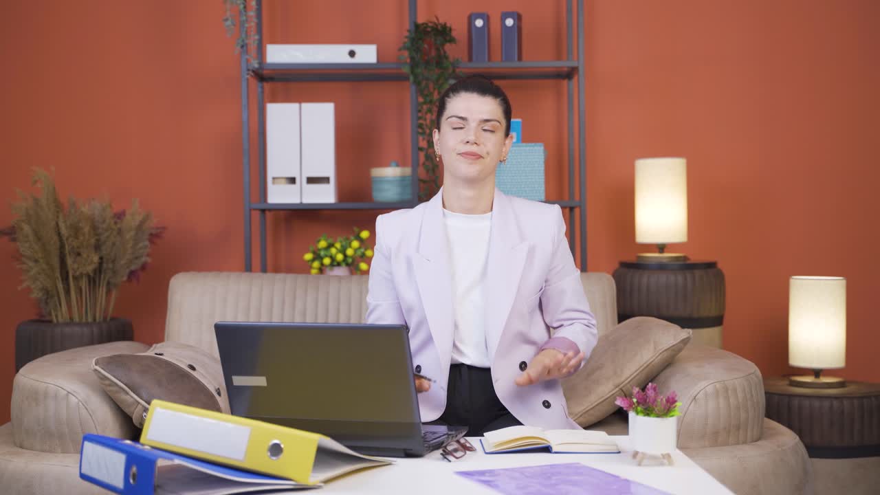 Home office worker young woman's hands are shaking.