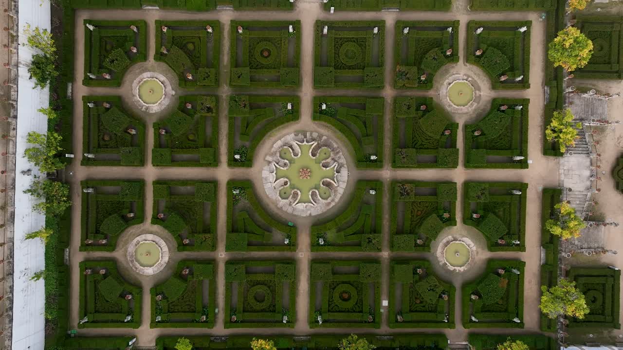 Aerial view over Jardim do Paço Episcopal in Castelo Branco, a Baroque gem with ornate lakes, statues, and manicured hedges, revealing a serene blend of history and nature in the heart of the city.