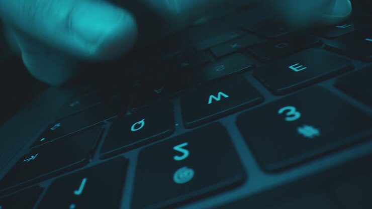 Close-up of Hands Typing on a Laptop Keyboard