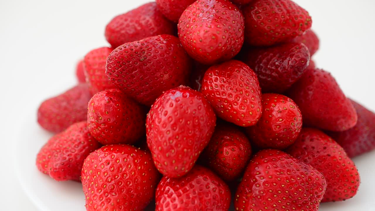 Strawberry on a white background, isolate. Shooting in the movement