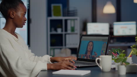 Black-woman-photo-retoucher-working-on-laptop-at-new-project