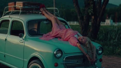 woman relaxing on a vintage car