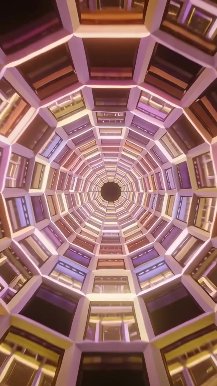Video vertical: Cámara ascendente revelando un pozo anillado en un hotel, con LEDs atrayendo la vista a la abertura central