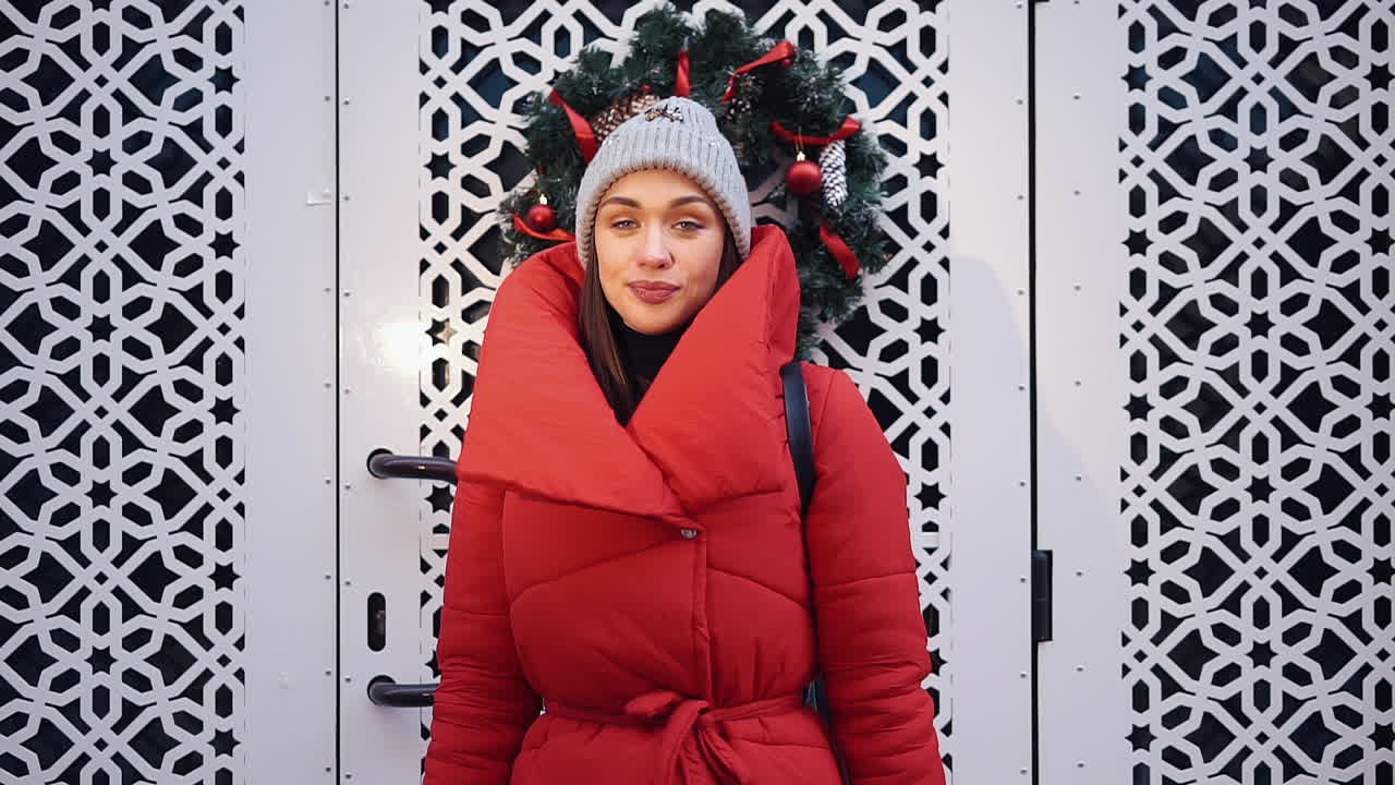 Woman in Winter Fashion in Front of Decorated Door