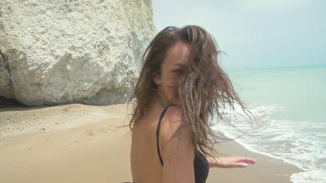 woman in a hat on a beach