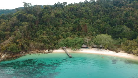 Aerial-drone-shot-of-a-secluded-beach-on-the-edge-of-the-rainforest-in-Borneo