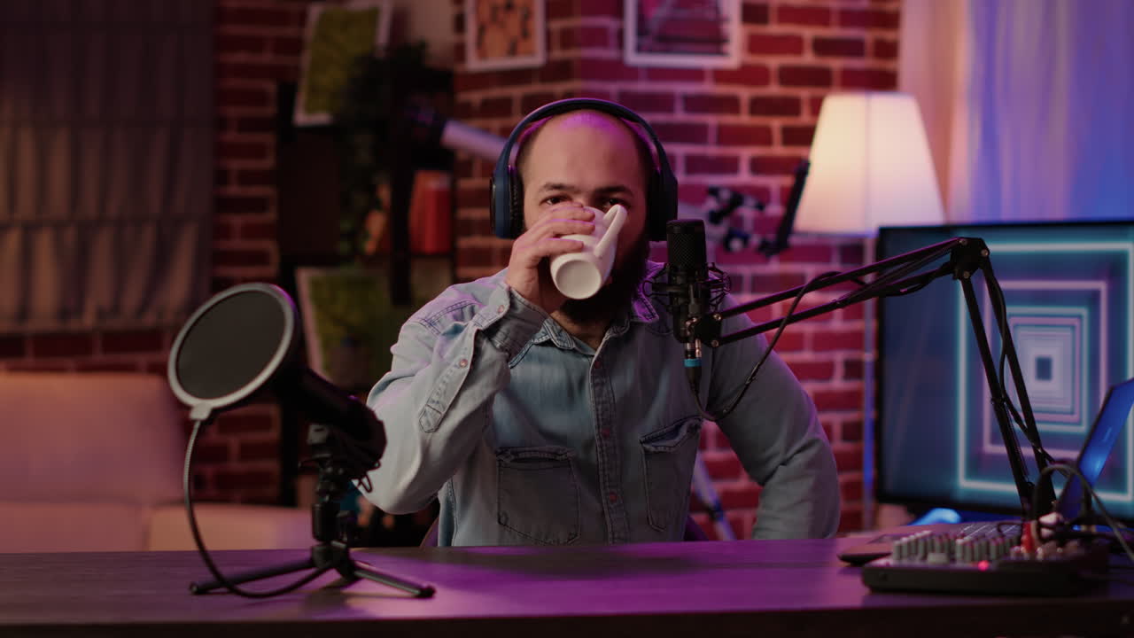 Portrait of online radio host posing casual using professional audio equipment and microphone