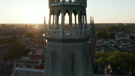 aerial view of the spire of the historic gouwekerk at dusk in gouda, south holland, netherlands