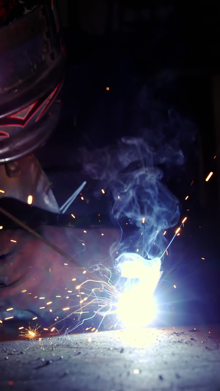 Welder working on a piece of metal