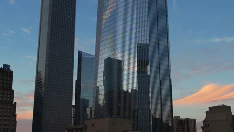 aerial - skyscrapers in downtown houston with reflections at dusk