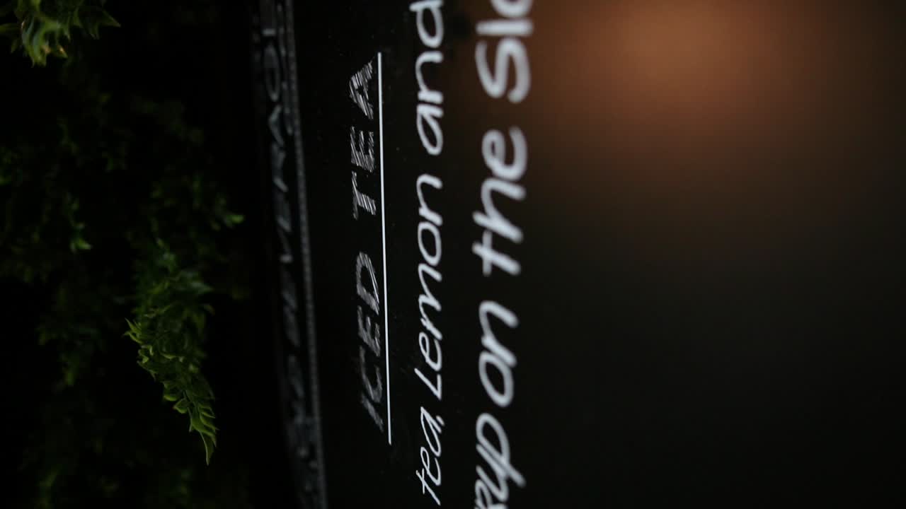 descending zoom footage of a menu chalkboard