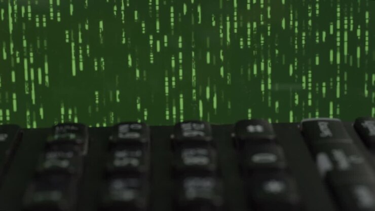 Black phone on desk with green data storm