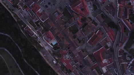 top down of obidos medieval town portugal during sunrise, aerial